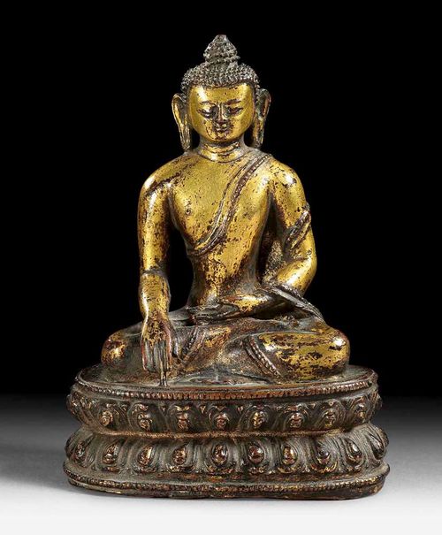 BUDDHA SHAKYAMUNI.Tibet, 16th century. H 14 cm. Gilt bronze, cleaned only in parts.
