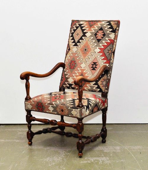 ELM ARMCHAIR,late Louis XIII, France, 19th century. With geometric patterned fabric cover.