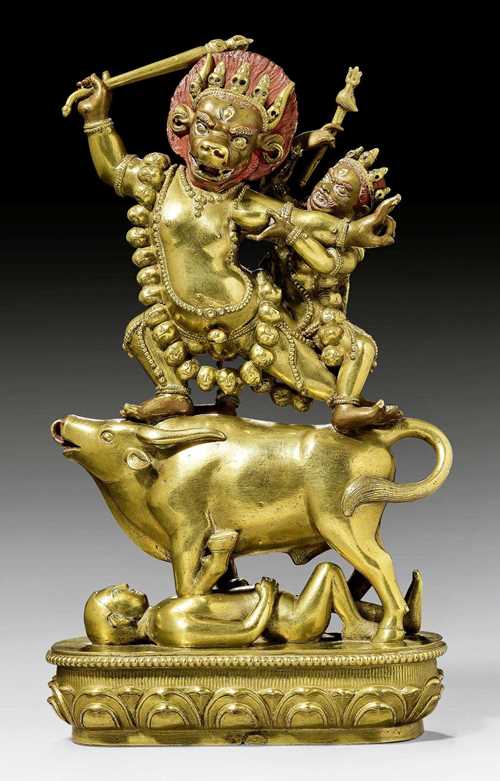 A RARE AND WELL CAST FIGURE OF YAMA AND YAMI STANDING ON A BULL. Mongolia, Zanabazar school, 19th c. Height 25.5 cm.
