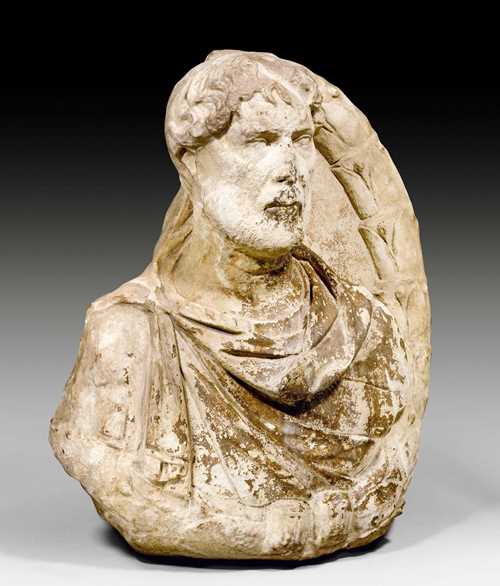LARGE BUST OF A ROMAN EMPEROR,probably Hadrian, eastern Mediterranean area, 2nd century AD. White/beige marble. Signs of weathering. H 62.5 cm.