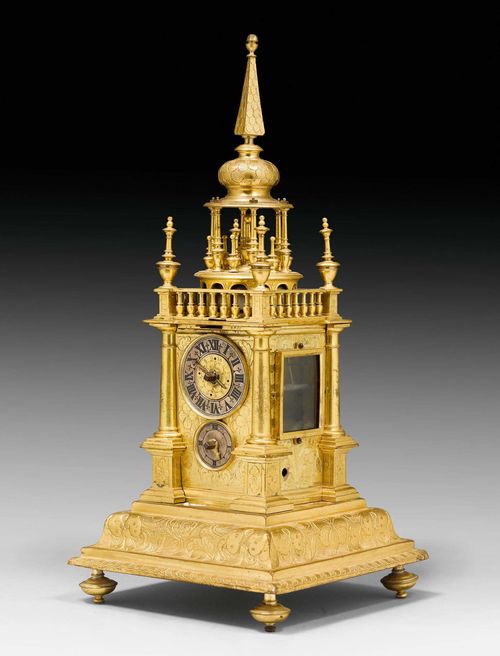 TURRET CLOCK,late Renaissance, probably Augsburg, early 17th century. Matte and polished gilt bronze. Silver-plated bronze chapter ring. Incomplete verge escapement striking the hours on bell. Alarm missing. Restoration required. 14x15x31 cm.