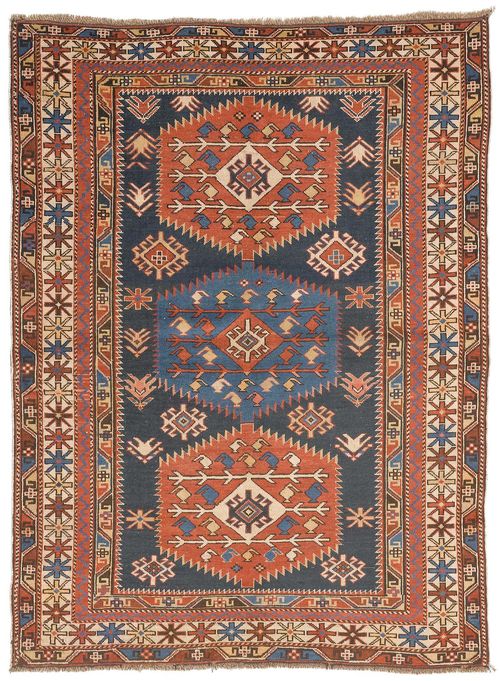 SHIRVAN antique. With three medallions on a dark blue central field, with geometric patterning and a four-stepped border in white and red. Some wear, 120x160 cm.