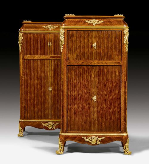 PAIR OF HALF-HEIGHT CABINETS,Louis XV style, in the style of H. DASSON (Henry Dasson, 1825-1896), Paris circa 1900. Tulipwood and rosewood in veneer, inlaid with diamond pattern, reserves and decorative frieze. The front with 2 slatted doors in front of differently fitted interiors of drawers and shelves.1 cabinet with top drawer. Exceptionally fine, matte and polished gilt bronze mounts and sabots. 72x40x145 cm.