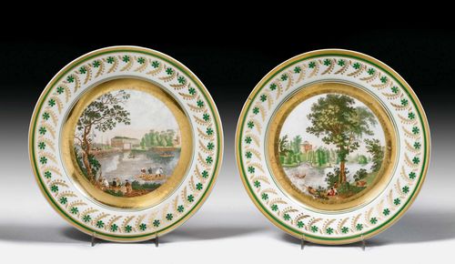 PAIR OF PLATES WITH RUSSIAN VIEWS OF THE ROCK ISLAND AND PAVLOVSK, Russia, 19th century. Cyrillic inscription in black on the back describing: "view of the palace on the rock island" and "view of the palace in Pavlovsk". Without marks. D 23.5 cm. (2) Provenance: Traditionally considered to have been a gift from the last Tsar to one of his confectioners. -Via inheritance in a Swiss private collection.