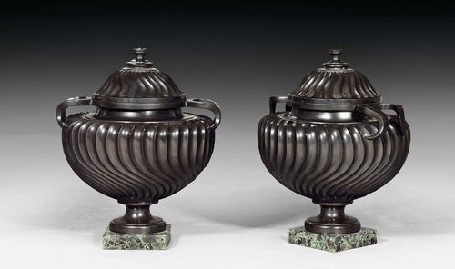 PAIR OF ORNAMENTAL LIDDED VASES,Louis XVI, probably by C. DE WAILLY (Charles de Wailly, 1730-1798), France, late 18th century. Black and "Vert de Mer" marble. H 50 cm.