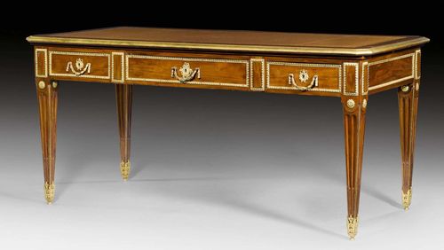 BUREAU PLAT,Louis XVI style, in the style of P. GARNIER (Pierre Garnier, maitre 1742), Paris, 19th century. Mahogany veneer. Rectangular top lined with gold-stamped, brown leather and edged in brass. The front with broad central drawer, flanked on each side by 1 drawer. Same, but sham arrangement verso. Side pull-out shelf with matching lining. Rich matte and polished gilt bronze mounts and sabots. 163x81x77 cm.