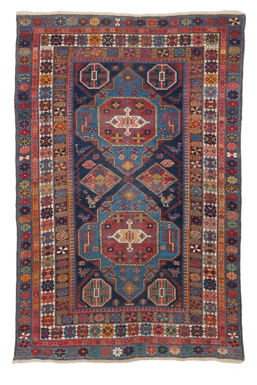 CAUCASIAN antique.Dark blue central field with light blue medallions, the entire carpet is geometrically patterned, stepped border, slight wear, 130x190 cm.