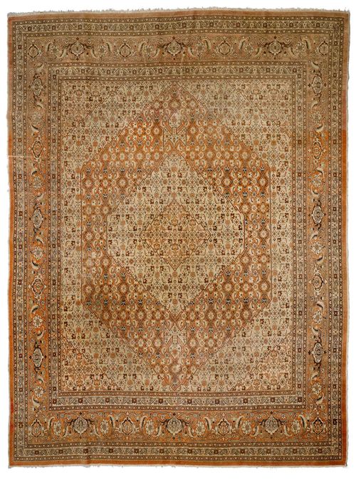 TABRIZ antique.Rust coloured and light green central field with a central medallion, patterned with stylized trailing flowers, rust coloured edging, signs of wear, 303x395 cm.