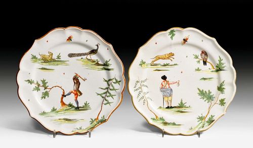 PAIR OF FAIENCE PLATES,Milan, Felice Clerici factory (1745-1788), circa 1765. Painted 'a paesini e figure a smalto' with figures, animals and plants, with an iron-red and a golden border. Marked 'Milano' in red. D 23.5 cm. One plate restored.