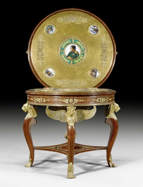 ROUND CENTER TABLE WITH PORCELAIN PLAQUES,Empire style, one plaque signed and dated VERESTE HAGUINET 1812, probably Russia, late 19th century. Shaped mahogany, the plaques with depictions of Napoleon and his campaigns. Rich bronze applications. 1 leg repaired. D 84 cm, H 74 cm.