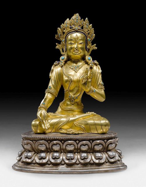 A FINE GILT COPPER ALLOY FIGURE OF THE WHITE TARA SEATED ON A SILVER LOTUS BASE. Tibet, 18th/19th c. Height 14.8 cm.
