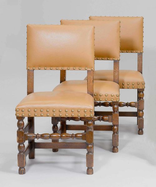 SUITE OF 4 CHAIRS, Louis XIII style. Turned oak. Padded seat and backrest. Light brown imitation leather cover with brass bullen nails.