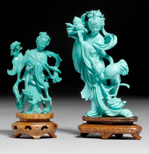 TWO FIGURES OF STANDING LADIES IN A TURQUOISE-LIKE MATERIAL.