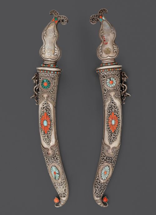 TWO DAGGERS WITH SILVER HILTS AND SCABBARDS SET WITH CORALS, MALACHITE AND TURQUOISES.