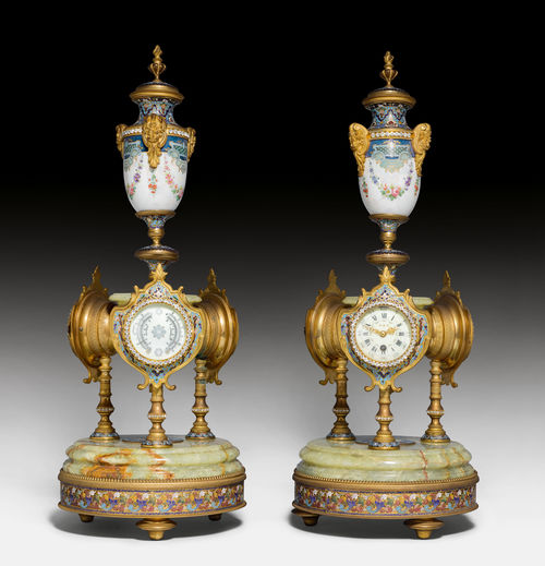 A PAIR OF LAVISHLY DECORATED WEATHER STATIONS CONTAINING A CLOCK, A BAROMETER AND A THERMOMETER.