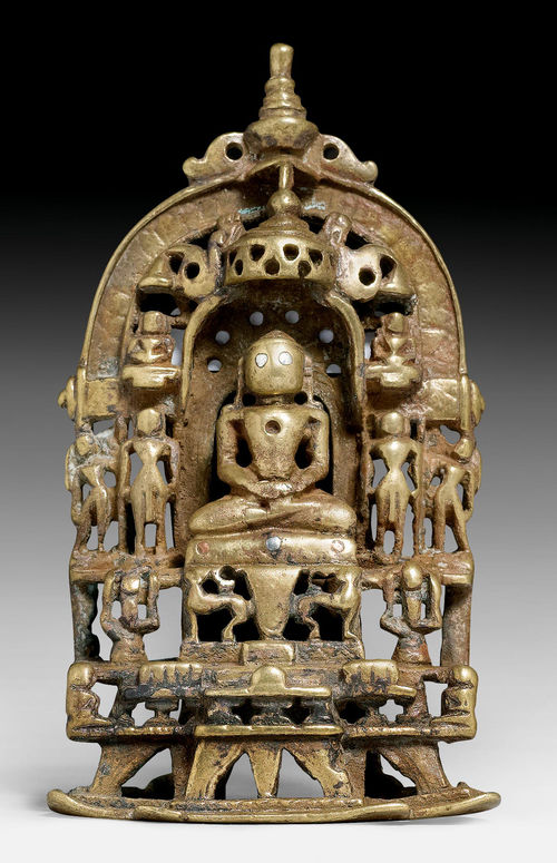 A SMALL BRASS JAIN ALTAR WITH SILVER AND COPPER INLAYS AND INSCRIPTIONS.