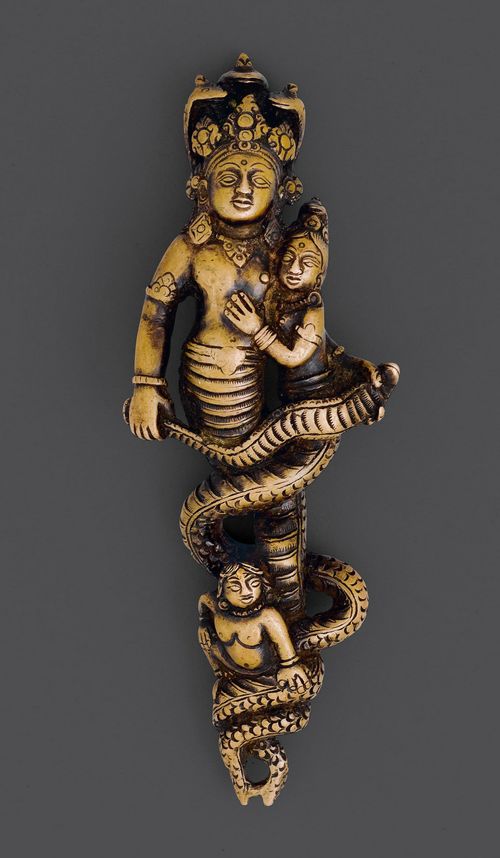 A FINE AND RARE COPPER ALLOY FIGURE OF NAGARAJA KALYA WITH HIS WIFE AND KRISHNA AS A BOY.