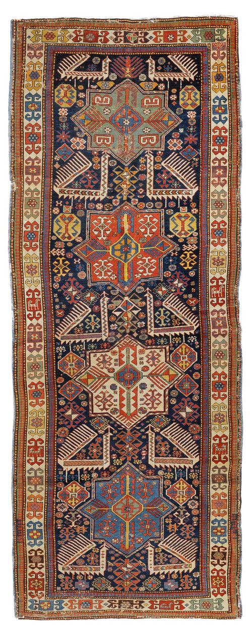 AKSTAFA antique.Black central field with four star-shaped medallions, geometrically patterned, white edging, strong signs of wear, restored, 110x278 cm.