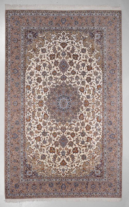 ISFAHAN old.White ground with a central medallion, finely patterned with trailing flowers and palmettes, beige edging, slightly stained, 253x362 cm.