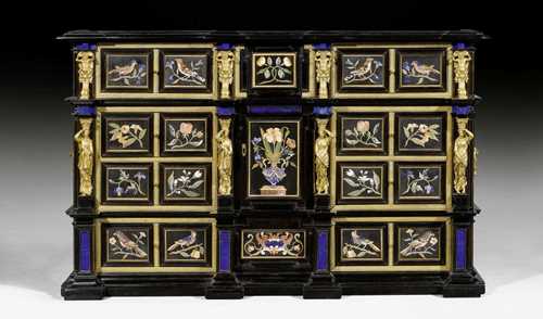 IMPORTANT CABINET WITH "PIETRA DURA" INLAYS,Renaissance, Florence circa 1650. Shaped and ebonized wood, the front doors with exceptionally fine "Pietra Dura" inlays. On a later stand. The front with central door between 2 drawers, flanked on each side by 4 drawers between bronze caryatids. The interior fitted with 4 small drawers. Exceptionally rich, matte and polished gilt bronze mounts and applications in the form of caryatids, sirens and decorative frieze. 120x37x75 cm. H with stand 165 cm.