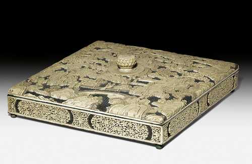 A CARVED RELIEF SOAPSTONE AND LACQUER BOX.