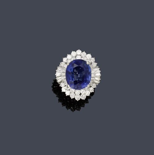 SAPPHIRE AND DIAMOND RING, ca. 1950. Platinum 800. Classic-elegant, fancy ring, the top set with 1 oval sapphire of ca. 20.00 ct within a double-border of 24 baguette-cut diamonds weighing ca. 2.90 ct and 32 brilliant-cut diamonds weighing ca. 4.00 ct. Size ca. 56. With copy of insurance estimate, March 2012.