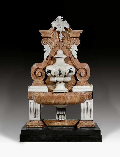 IMPORTANT WALL FOUNTAIN,Baroque, Veneto, early 18th century. "Calcare rosa di Verona" and "Pietra di Vicenza". The front with central vase with 3 spouts over basin. 2 spouts later. 145x100x270 cm.