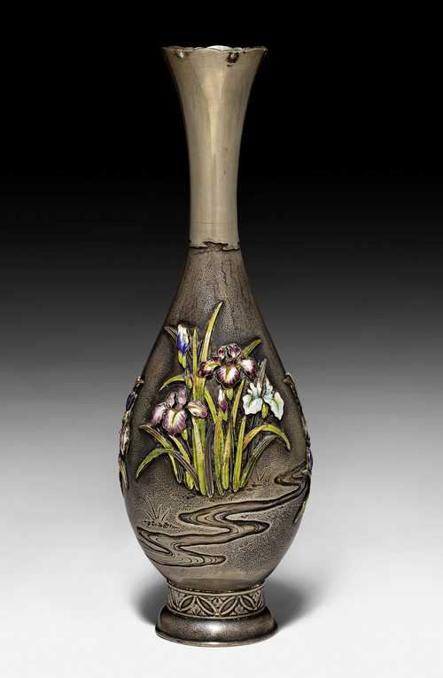 A SILVER VASE WITH RELIEF DECORATION OF IRISES, PAINTED IN POLYCHROME ENAMELS.