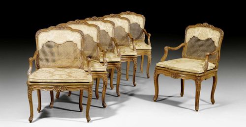 SET OF 6 FAUTEUILS "A LA REINE",Regence/Louis XV, stamped I. NADAL (Jean Nadal, maitre ca.1740), Paris circa 1740. Exceptionally finely carved beech. Caned and with yellow silk cushions. 67x45x49x95 cm.