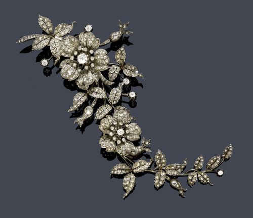 DIAMOND BROOCH, France, ca. 1880. Silver over pink gold. Very fancy, four-part, large brooch "en tremblant" designed as a cascading flower branch, the blossoms set with 7 old European cut diamonds weighing ca. 1.60 ct, the buds and the leaves set throughout with numerous rose-cut diamonds weighing ca. 3.00 ct. L ca. 19 cm.