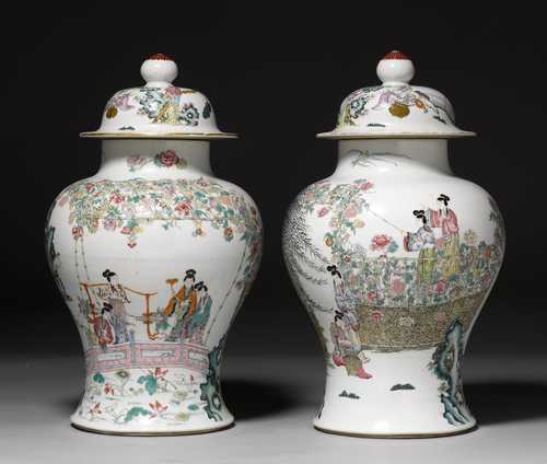 A PAIR OF FAMILLE ROSE COVERED VASES WITH SCENES OF LADIES IN GARDENS AND UNDERGLAZE BLUE QIANLONG MARK.