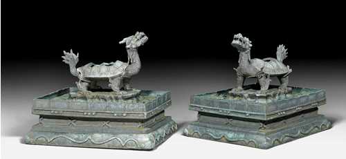 A FINE PAIR OF IMPERIAL BRONZE CENSERS IN THE SHAPE OF DRAGON-TURTLES (BIXI).