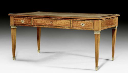 BUREAU PLAT,Louis XVI, France circa 1800/10. Mahogany. Rectangular top lined with green leather and edged in bronze. The front with broad central drawer between 2 smaller drawers. Leather-lined pullout shelves on each side. Bronze mounts and sabots. Restoration required. 160x81x78 cm.