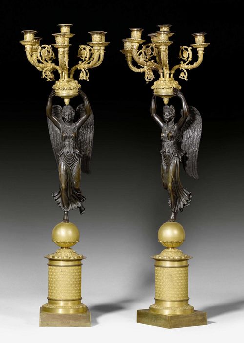 PAIR OF CANDELABRA "AUX VICTOIRES",Empire, in the style of P.P. THOMIRE (Pierre Philippe Thomire, 1751-1843), Paris circa 1810/20. Gilt and burnished bronze. Fitted for electricity. H 84 cm.