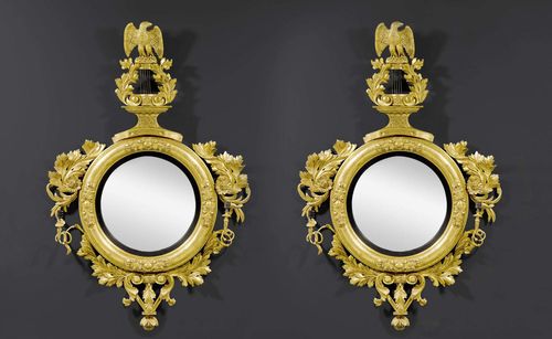 PAIR OF IMPORTANT MIRRORS "AUX AIGLES",Restauration, England or America circa 1815/25. Pierced and exceptionally richly carved giltwood. Round frames with 2 light branches each. Convex mirror glass. H 168 cm, W 109 cm. Provenance: - Messmore Kendall collection, USA. - Butterfield&Butterfield auction on 11.5.1994 (Lot No. 96). - Private collection, USA.