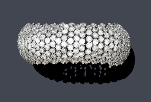 A DIAMOND BRACELET. White gold 585. Set with diamonds of a total of ca. 51.00 ct. width ca. 2.5 cm, L ca. 19 cm. With case.