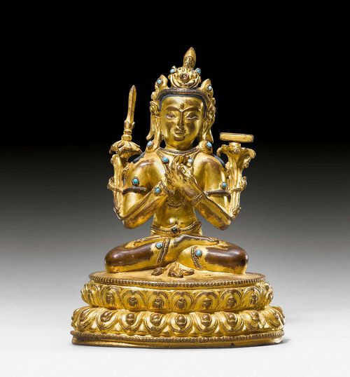 A GILT COPPER FIGURE OF MANJUSHRI WITH SILVER AND TURQUOISE INLAYS. Tibet, 14th/15th c. Height 15 cm. Sealed.