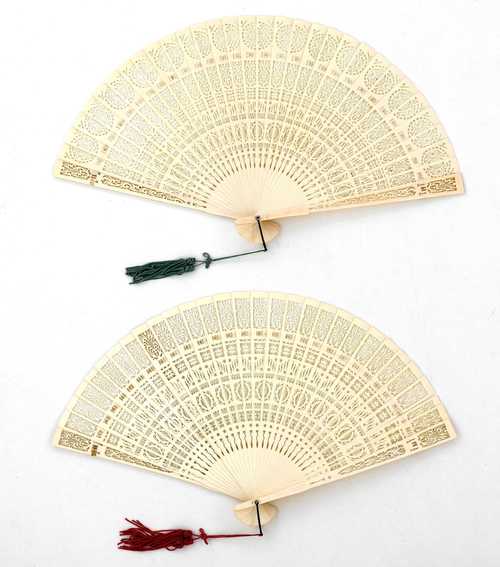 TWO OPENWORK IVORY FANS.