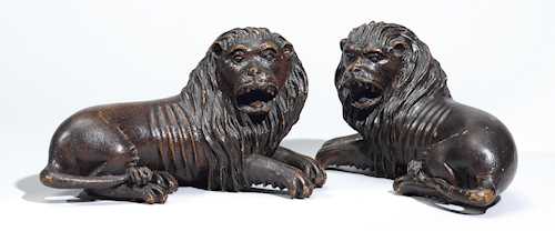 A PAIR OF CARVED LIONS