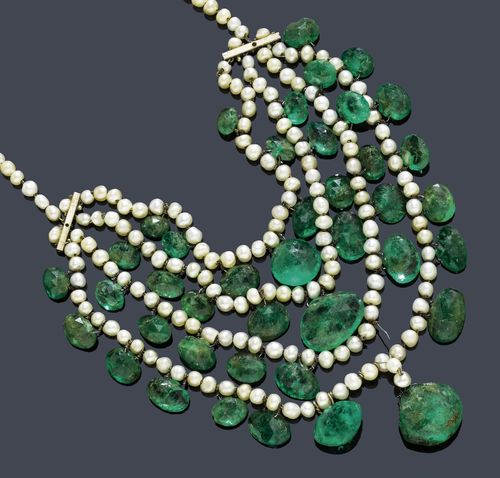 NATURAL PEARLS AND EMERALD NECKLACE, India, ca. 1900. Very decorative necklace of small natural pearls, graduated from 2.9 to 4.3 mm Ø, the four-row lower part additionally decorated with 39 emeralds in different cuts and weighing ca. 100 ct, 1 missing. L ca. 37 cm.