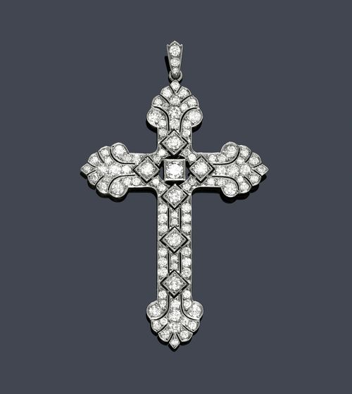 DIAMOND PENDANT, ca. 1935. Platinum. Decorative, open-worked pendant designed as a cross with palmette and lozenge motifs, set throughout with numerous brilliant-cut diamonds, older cut, weighing ca. 3.00 ct. The eyelet additionally decorated with 3 brilliant-cut diamonds. L ca. 6.5 cm.