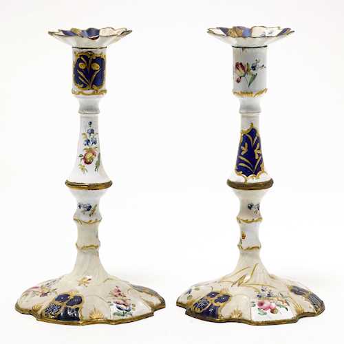 A PAIR OF ENAMELED CANDLESTICKS,