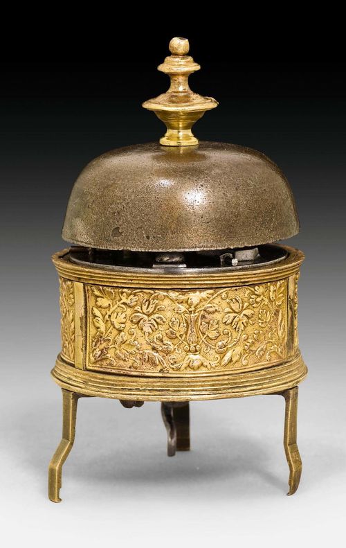 SMALL TRAVEL ALARM CLOCK,Renaissance, German circa 1570. Gilt bronze and brass. Partly replaced iron movement with verge escapement.  D 48 mm. H 82 mm.