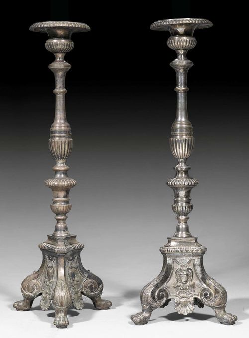 PAIR OF TALL CANDLESTICKS AS LAMPS, Baroque, probably northern Italy circa 1720. Silver-plated, chased brass. Fitted for electricity. H without light holder 82 cm.