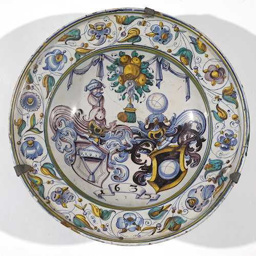 A FAIENCE PLATE WITH ALLIANCE COAT OF ARMS