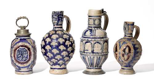 A GROUP OF FOUR STONEWARE JUGS