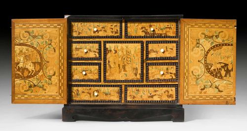 SMALL CABINET,early Baroque, probably Augsburg, 17th century. Pearwood, partly ebonized and with exceptionally fine inlays of various fruitwoods. On a later base. The interior fitted with central door and drawers. Bone knobs. Some restoration required. 45x27x40 cm.