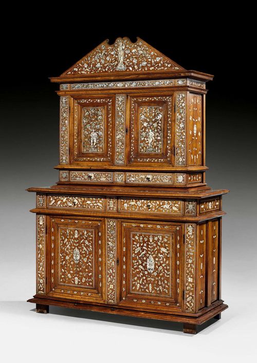 DEUX-CORPS CABINET,Renaissance, Loire region circa 1570/80. Walnut, ivory and mother of pearl with exceptionally fine inlays; allegorical figures of "abondance" and Minerva, lions, chimera, flowers, leaves and ornamental frieze. The lower section with double doors below 2 adjacent drawers. Slightly recessed upper section with double doors above 2 adjacent drawers. Bronze mounts and knobs. 138x55x202 cm.
