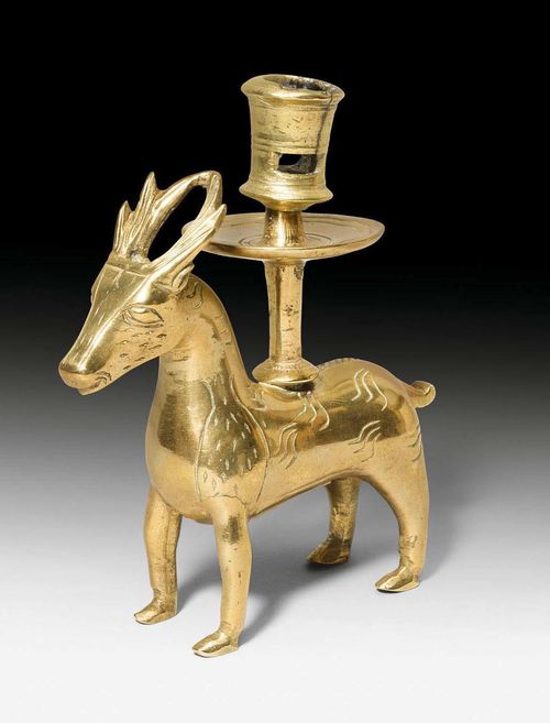 CANDLESTICK IN THE FORM OF A DEER,in the early Baroque style, probably South German. Gilt and engraved bronze. Some losses. H 17.5 cm.