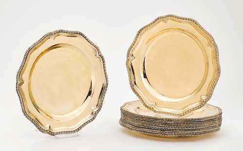 12 SILVER-GILT CHARGER PLATES